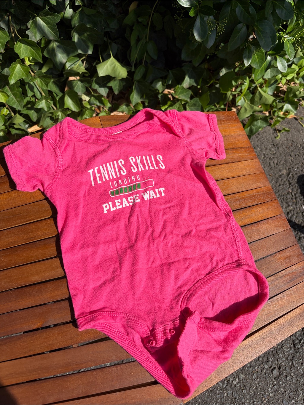 Pink Baby Onesie With 'Tennis Skills Loading' Graphic